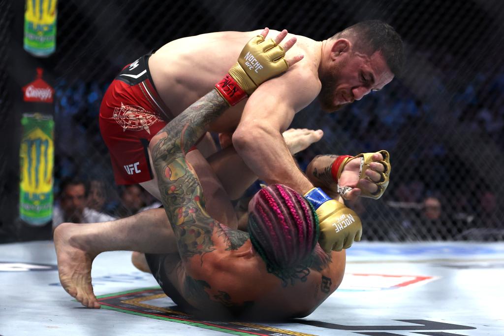 Merab Dvalishvili (above) fights Sean O'Malley during his UFC 306 victory.